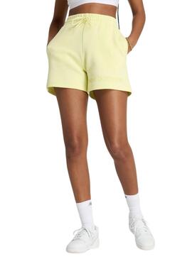 Kurze New Balance Density Gelb für Frauen.