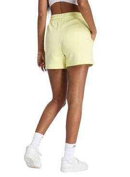 Kurze New Balance Density Gelb für Frauen.