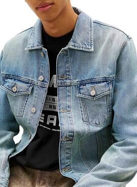 Blaue Jeansjacke von Tommy Jeans Ryan in heller Waschung für Herren.